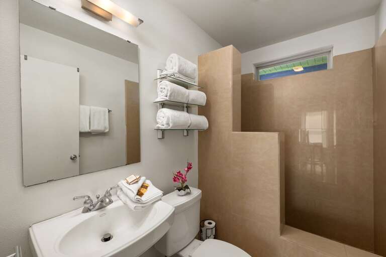 Villa #2
Guest bathroom with tiled walk-in shower.