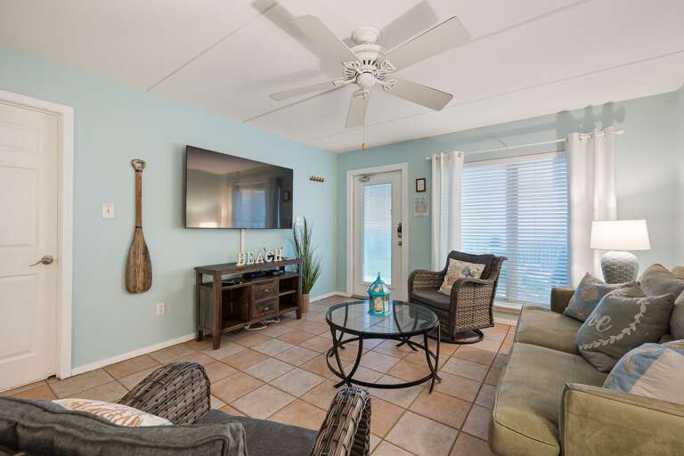 Living Area surrounds a flat screen TV perfect for family movie nights!