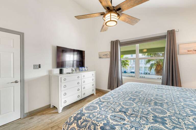 1st bedroom features a large flat screen TV.