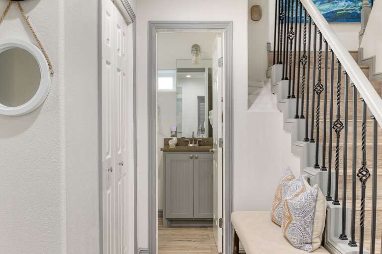 Ground floor half bathroom just off the entryway and sitting area.