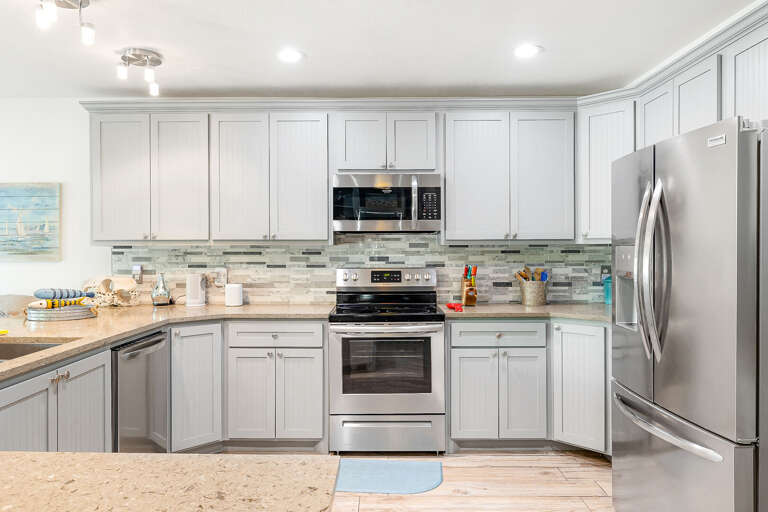 This kitchen is fully stocked with kitchen cookware and small appliances!