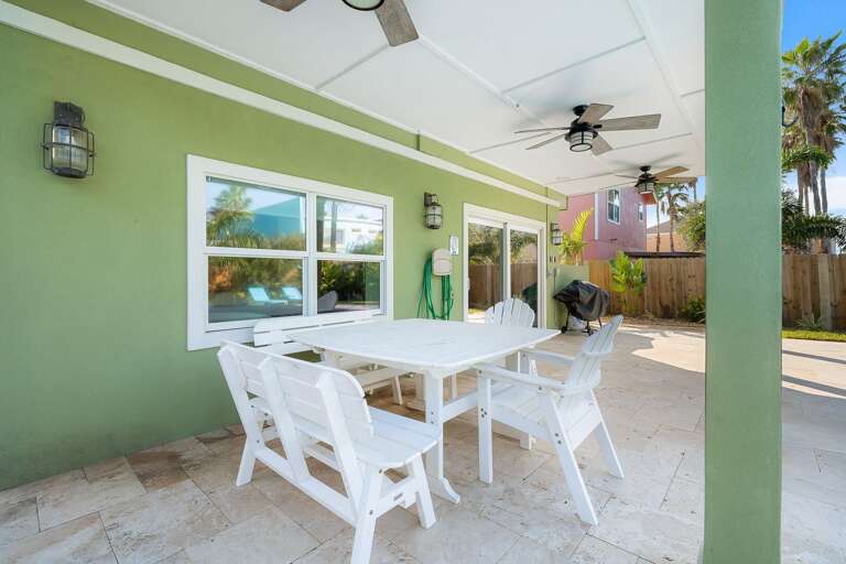 Poolside dining on the covered patio.