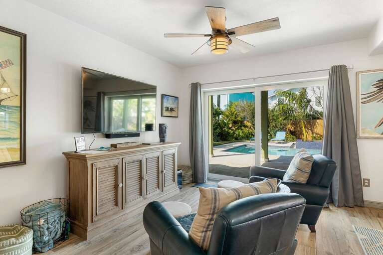 Spacious beach-themed living area with flat screen TV!