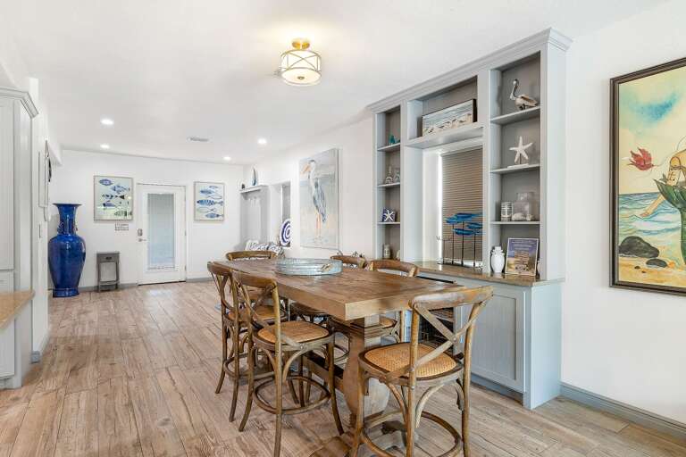 This tastefully decorated home is the perfect backdrop for your beach getaway! Dining area with seating for 6, additional bar seating for 4.