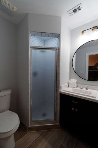Attached private bathroom off ground floor guest bedroom.