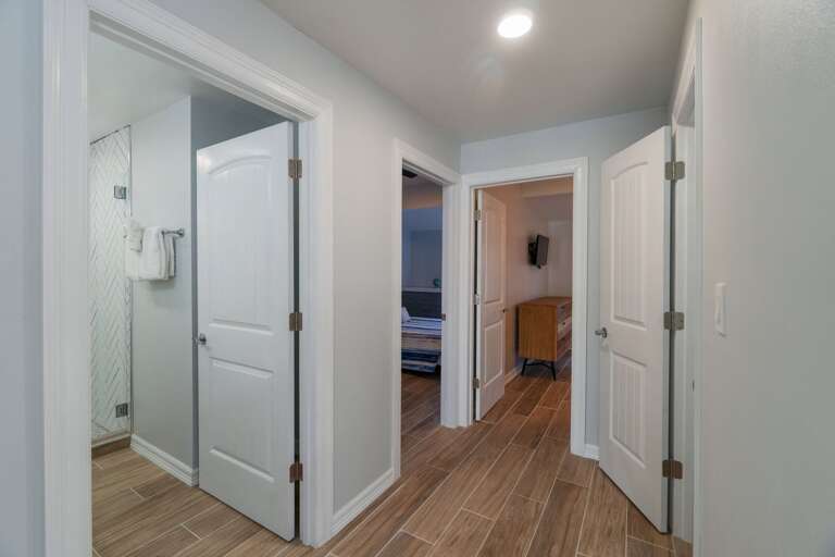 Hallway off the kitchen on the 2nd floor. This floor entails a full guest bathroom and a separate half bathroom. Along with two of guest bedrooms.