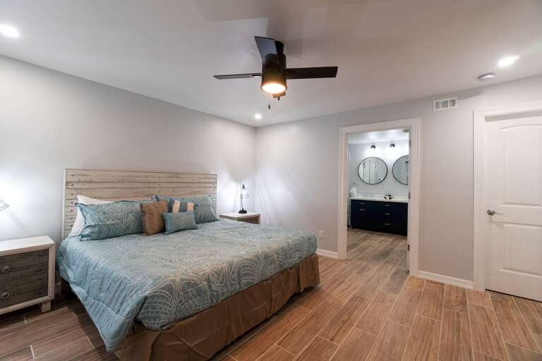 Master bedroom located on the ground floor features a King bed and private master bathroom.