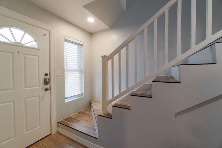 Stairway to the 2nd floor which entails the living room, dining area, kitchen and remaining guest bedrooms/bathrooms.