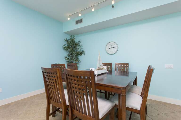 Dining room accommodates 8 guests with additional seating at the bar.
