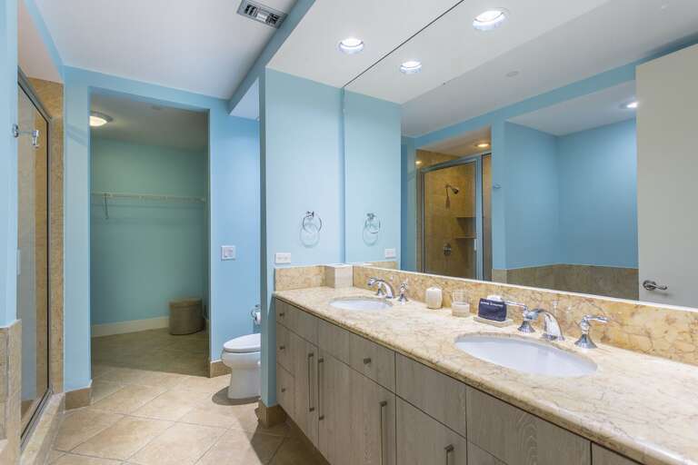 Spacious Master Bathroom with double sink and large vanity mirror.