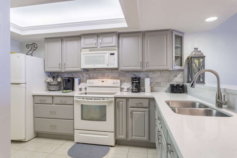Updated kitchen is equipped with all appliances and is fully stocked with pots, pans, cooking utensils, and dish ware Updated kitchen is equipped with all appliances and is fully stocked with pots, pans, cooking utensils, and dish ware