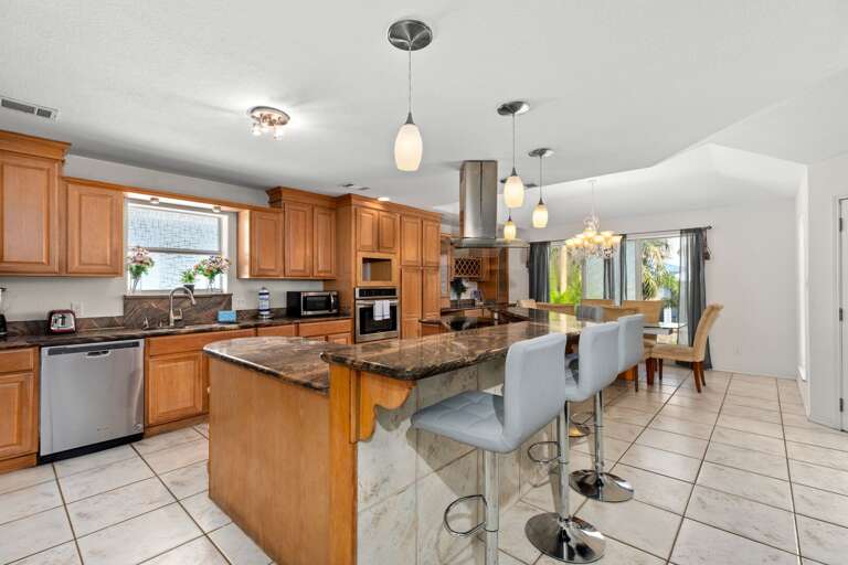 Fully stocked Kitchen area with extra bar space! Fully stocked Kitchen area with extra bar space!