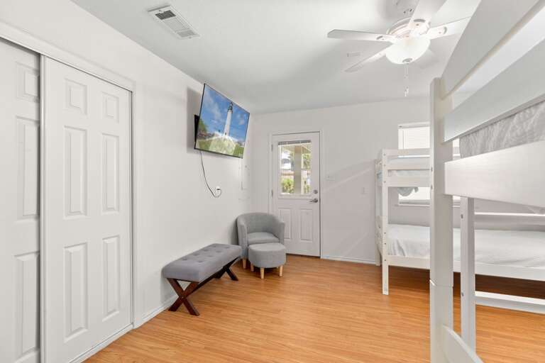 Guest bedroom features access to the pool area Guest bedroom features access to the pool area