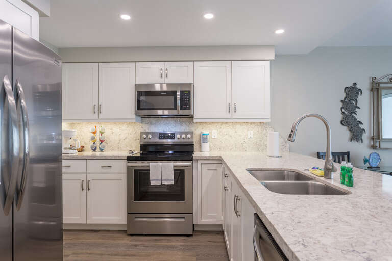 Kitchen has stainless steel appliances, including a dishwasher!