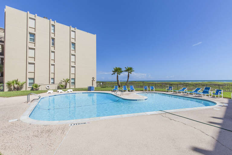 Large beachfront community swimming pool at Beach House condos! One of two pools the condo offers guests.