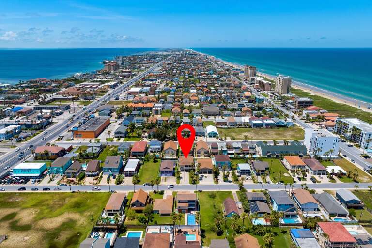 Aerial view of the property and of South Padre Island