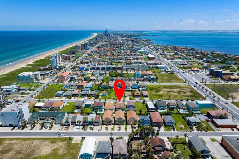 Aerial view of the property and of South Padre Island