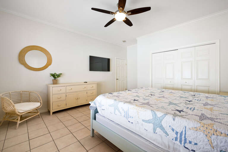 Guest bedroom with King bed and flat screen TV