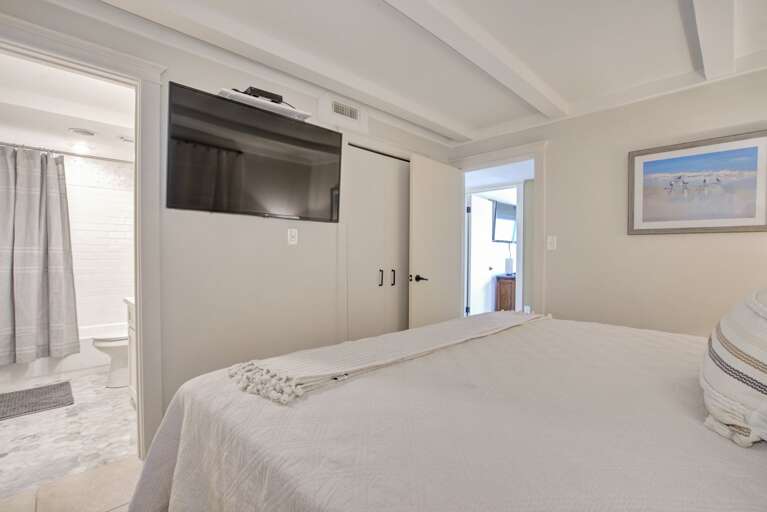 Bedroom 2 with a King bed, TV, and en suite bathroom. Bedroom 2 with a King bed, TV, and en suite bathroom.