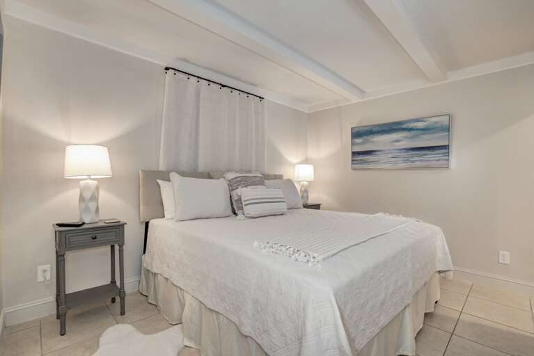 Bedroom 2 with a King bed, TV, and en suite bathroom. Bedroom 2 with a King bed, TV, and en suite bathroom.