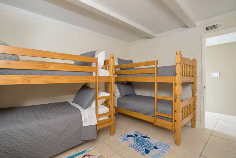 Bedroom 3 featuring 2 sets of twin bunk beds. Bedroom 3 featuring 2 sets of twin bunk beds.