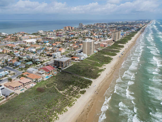Bird's eye view of the complex showing its close proximity to the beach.