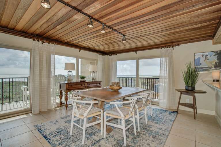 Dining area with seating for 8 guests (plus 2 more at the bar).
