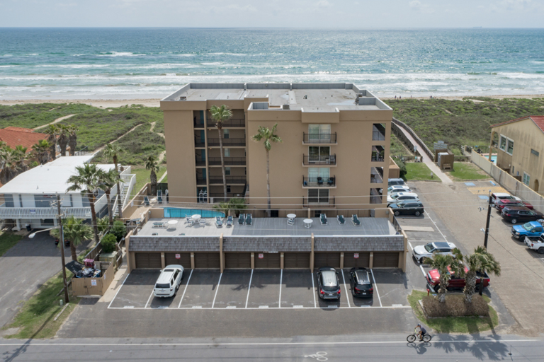 Second-floor beachfront living with direct access to the sand from Seagull Condominiums.
