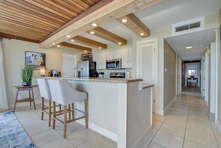 This fully stocked kitchen entails bar seating, and all utensils, appliances, and cookware you may need! This fully stocked kitchen entails bar seating, and all utensils, appliances, and cookware you may need!