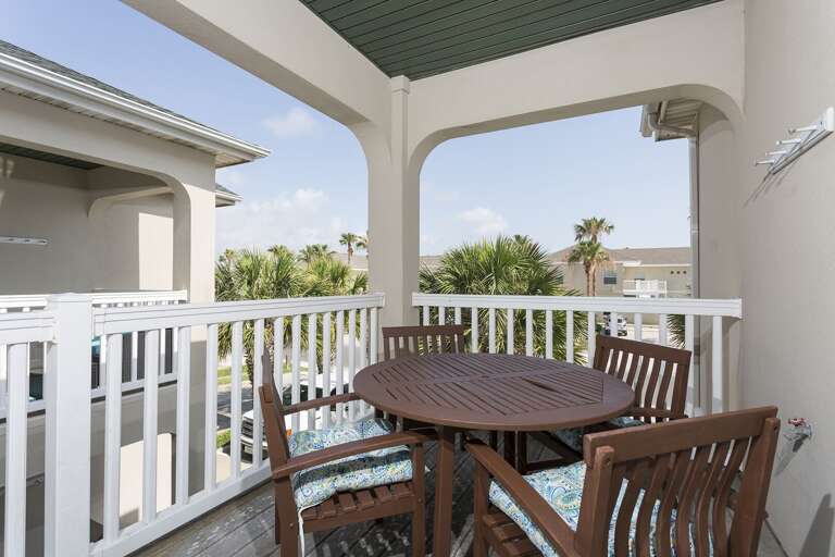 Front door landing with outdoor dining table. Front door landing with outdoor dining table.
