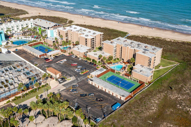 Aerial view of the property with the beach