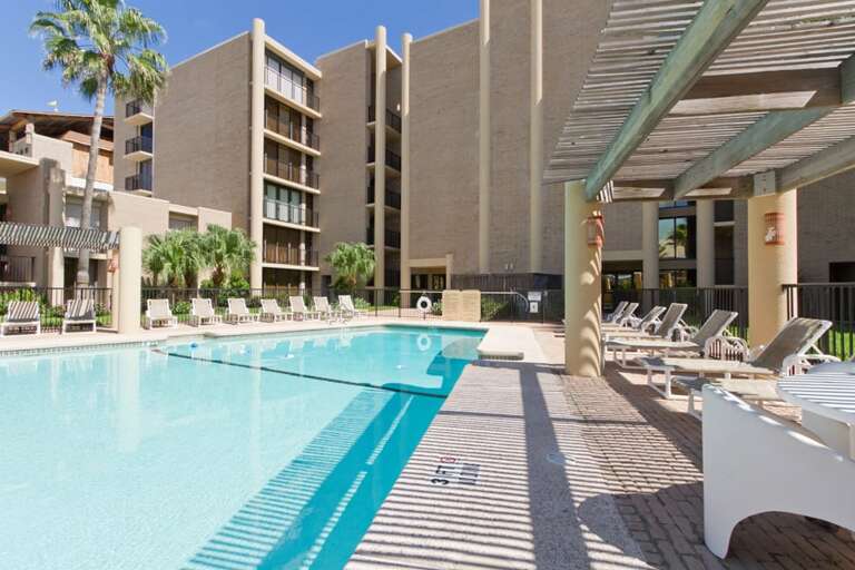 Community pool area provides plenty of space for relaxing in the sun