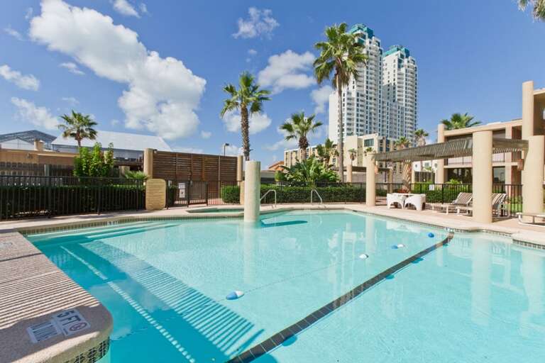 Grounds with tropical landscaping and poolside lounge areas