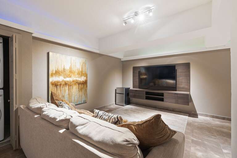4th Guest Bedroom on Ground Floor, includes a media space with large flat screen TV and ping pong table. 4th Guest Bedroom on Ground Floor, includes a media space with large flat screen TV and ping pong table.