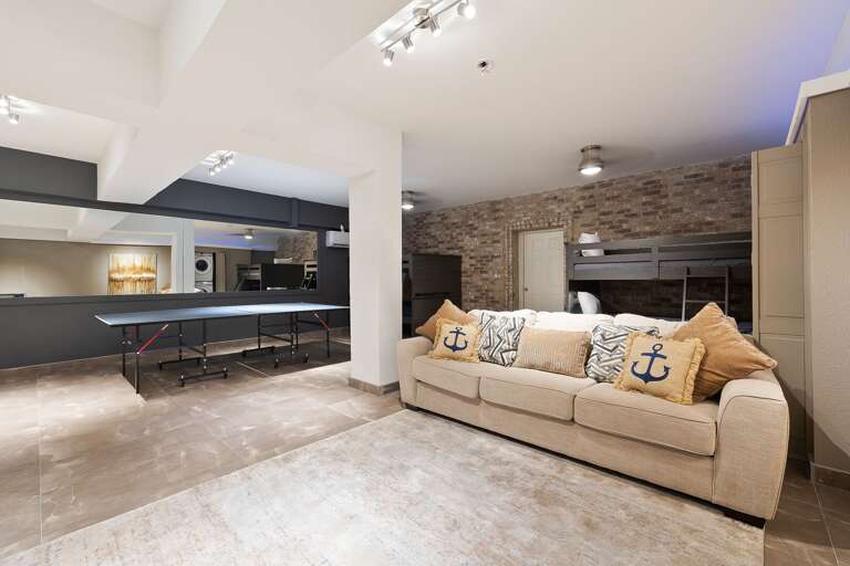 4th Guest Bedroom on Ground Floor, includes a media space with large flat screen TV and ping pong table.