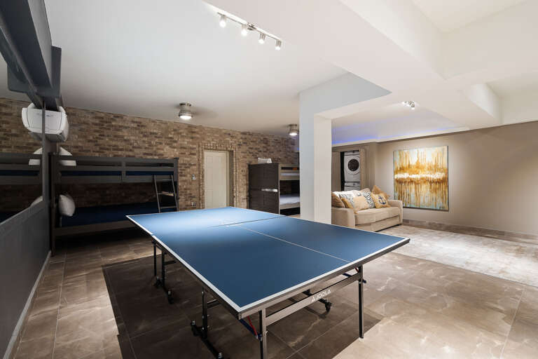 4th guest bedroom & media room with 4 full beds (sleeps 8), ping pong table and large TV. 4th guest bedroom & media room with 4 full beds (sleeps 8), ping pong table and large TV.