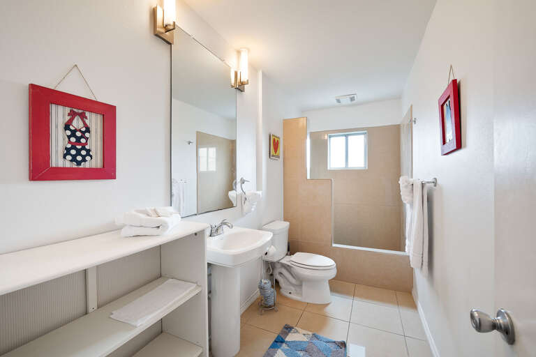 Bathroom with walk in tile shower.