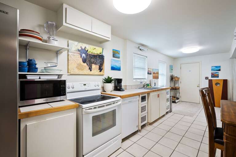 Fully stocked open concept kitchen.