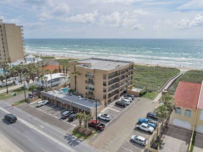 Aerial view of the complex. Beach access is located in the parking lot.
