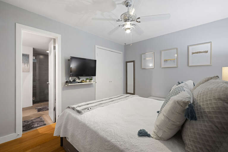 Bedroom 3 features a Queen bed, TV, and a shared guest bathroom.