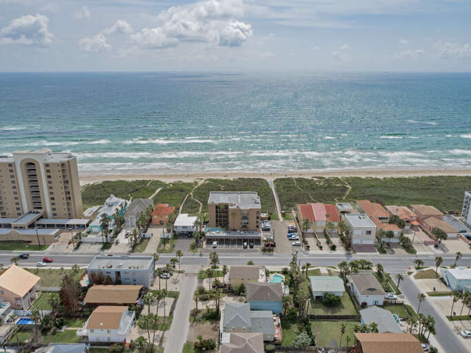 Bird's eye view of the complex showing its close proximity to the beach.