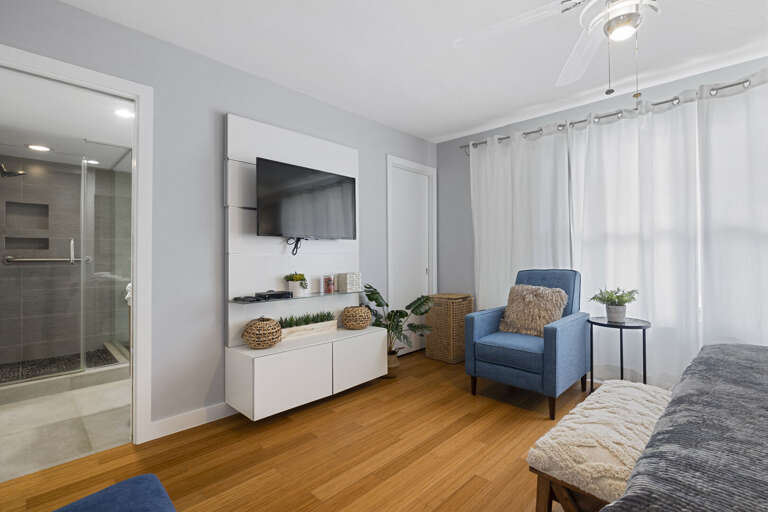 Master bedroom featuring a King bed, TV, and en suite bathroom.