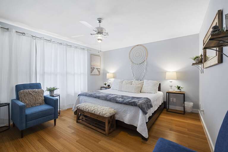 Master bedroom featuring a King bed, TV, and en suite bathroom.