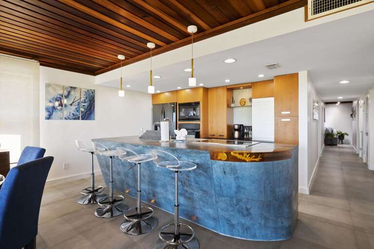 Seating for 4 at the kitchen bar.