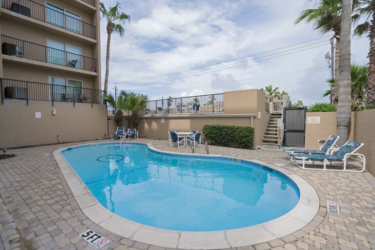 Spend sunny afternoons relaxing by the pool or soaking in the hot tub after a beach day.