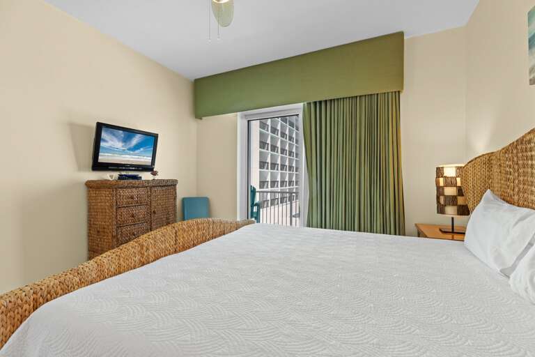 Comfy master bedroom with king bed, flat screen tv, and an ocean view!