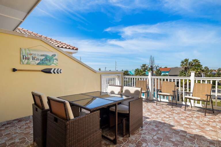 Patio is accessible from the living area perfect to catch the fireworks by the bay!