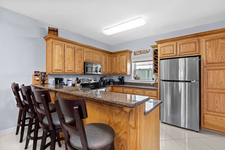 Kitchen Area with extra bar seating for up to 4 guest s