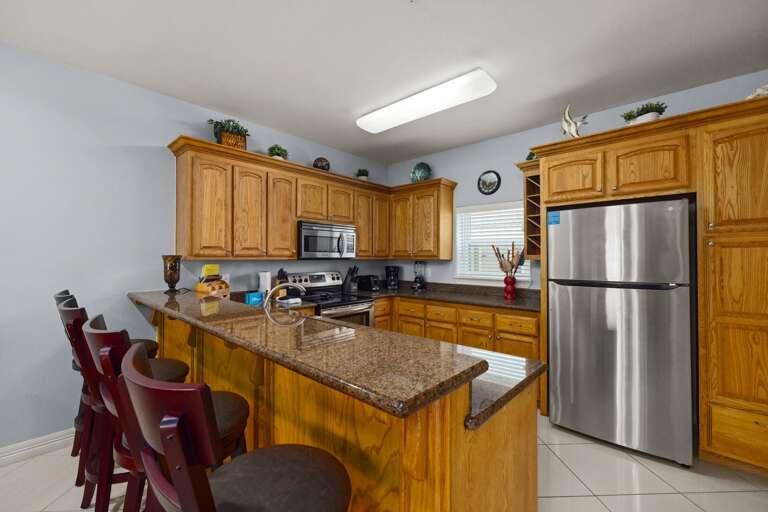 Kitchen Area with extra bar seating for up to 4 guests
