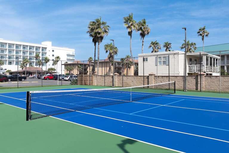 Palms Parade Past Pristine Pickleball Park, Buildings Behind